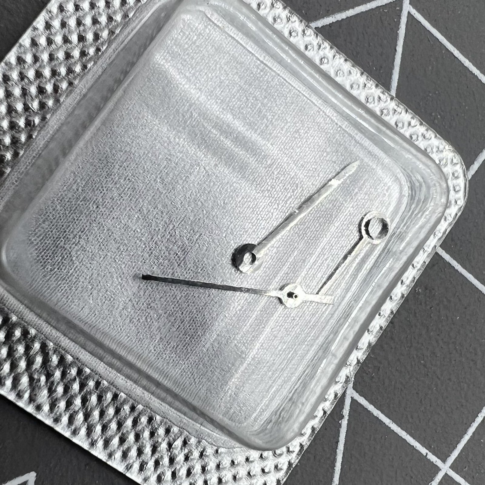 Silver watch hands set for ETA 956.112 movement, including hour, minute, and second hands.