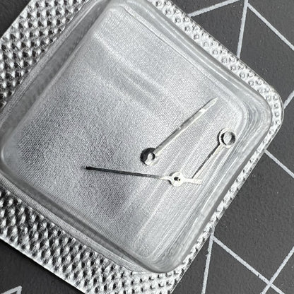 Silver watch hands set for ETA 956.112 movement, including hour, minute, and second hands.