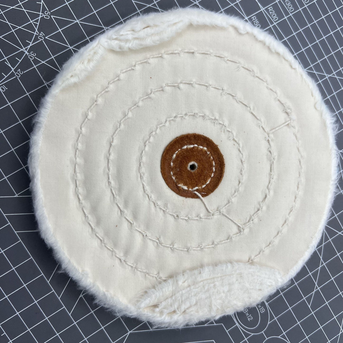 Swiss Bergeon 5175-150 white polishing buff wheel for precise watch finishing and detailing.