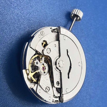 Tian Jing DG2813 automatic watch with mechanical movement, silver dial, and day-date display.