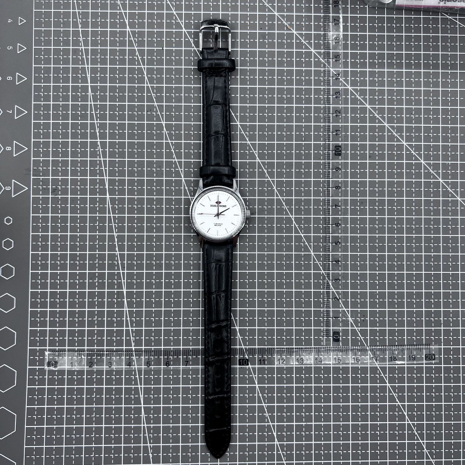 Beijing 31mm mechanical watch with black double rhomb strap, silver case, and three classic hands.