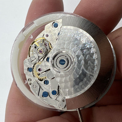 China Made 7750 mechanical watch movement with white dial, single calendar, small seconds at 3, 6, and 9 o'clock positions.