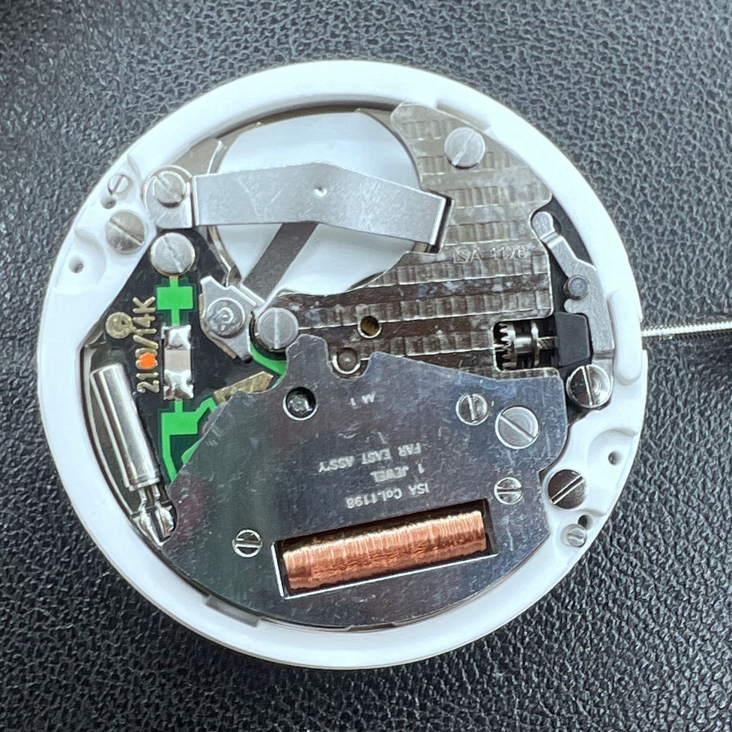 Swiss ISA 1198 quartz watch movement with day and date function for precise timekeeping.