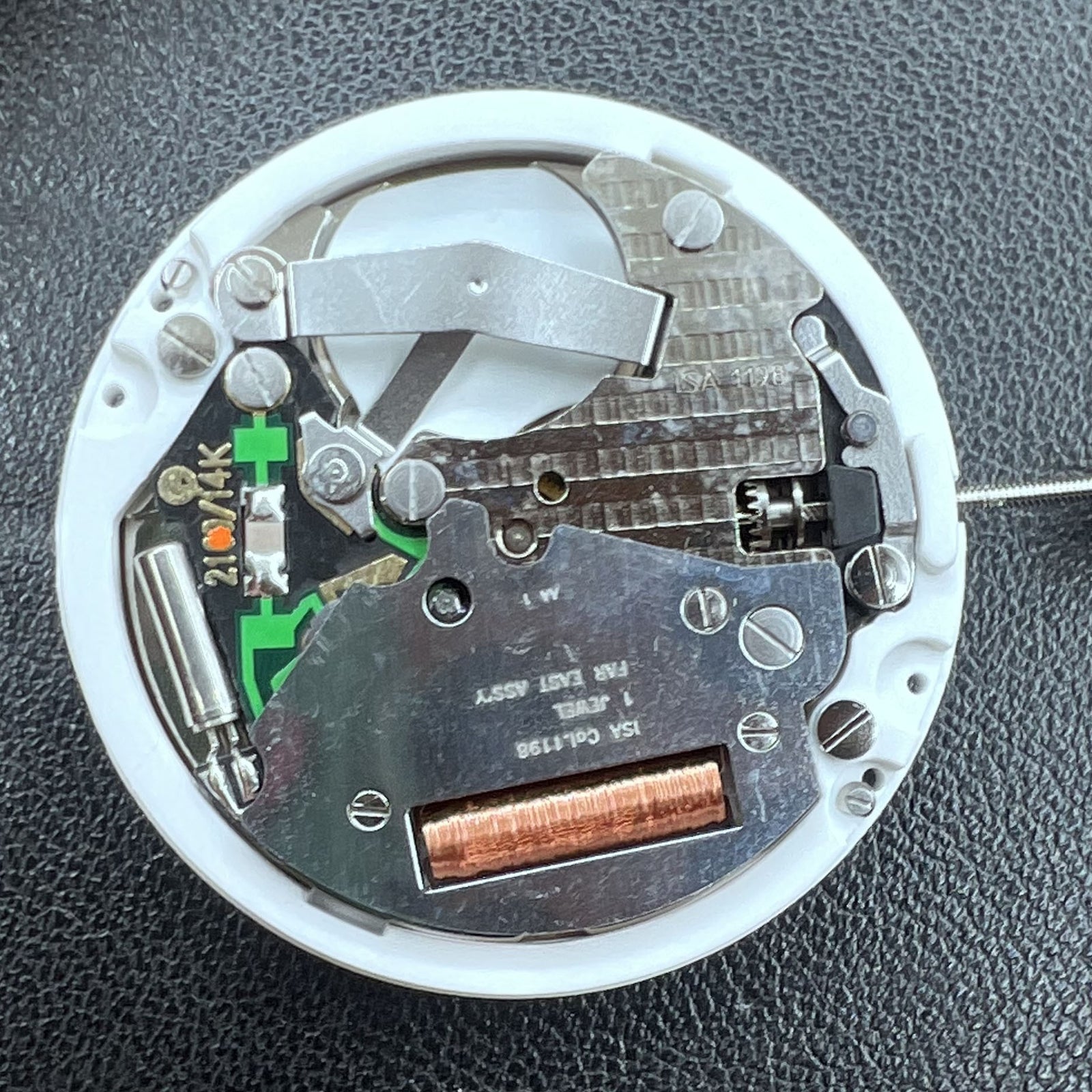 Swiss ISA 1198 quartz watch movement with day and date function for precise timekeeping.