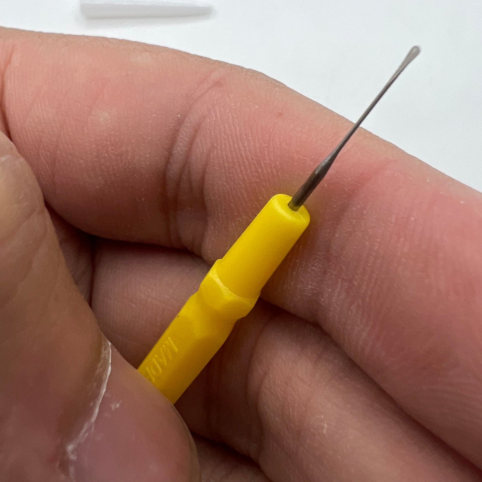 Bergeon 30102-D yellow watch dip oiler for precise Swiss watch repair and maintenance tools.