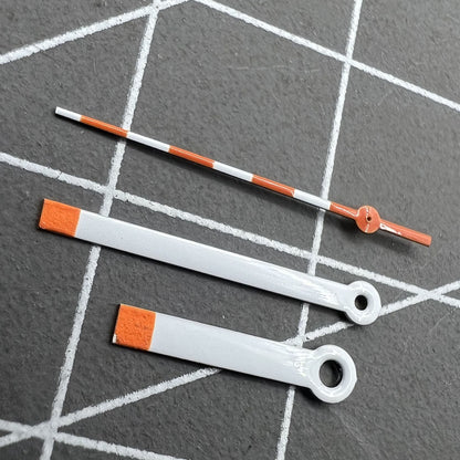 15mm orange and white painted watch hands set for Ronda 515 quartz, ideal for accurate timekeeping.