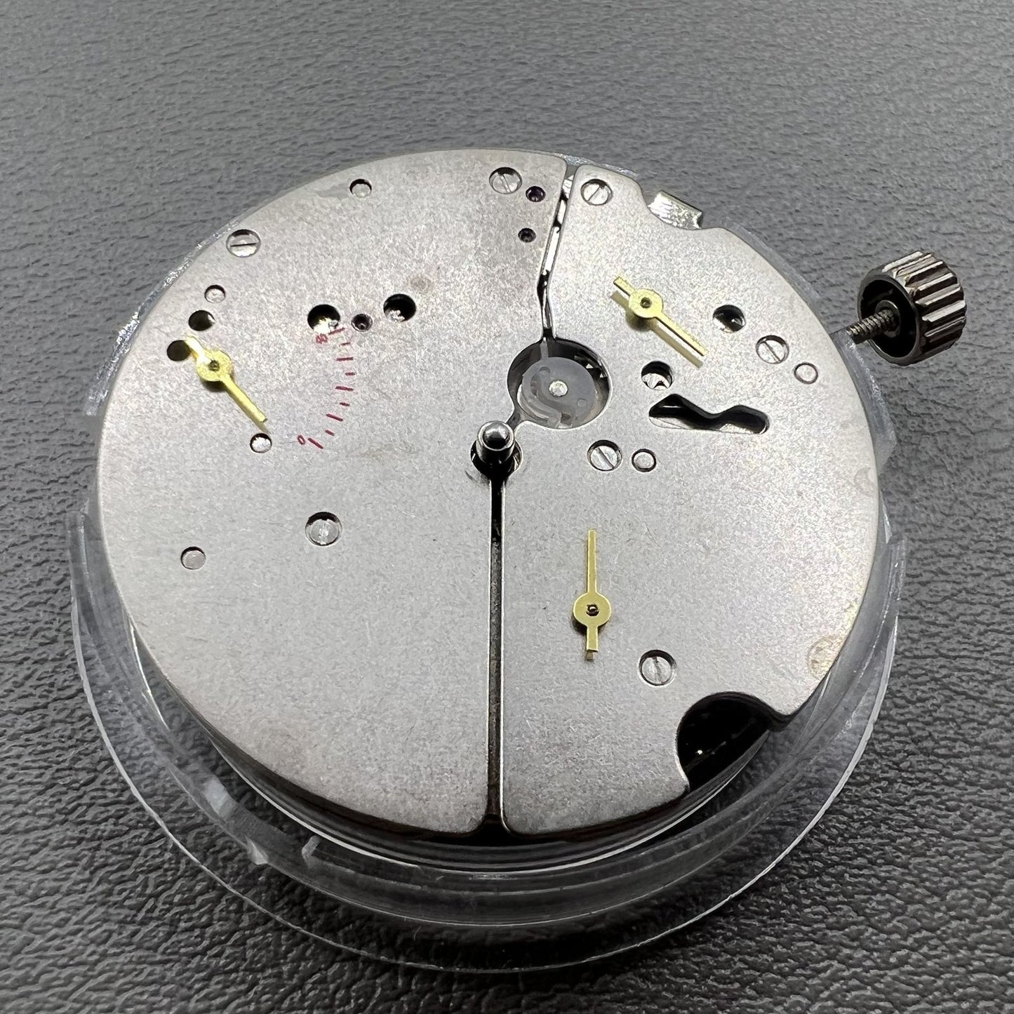 Tianjin ST17 T17 hand-wound watch movement with two hands and power reserve indicator at 10 o'clock.