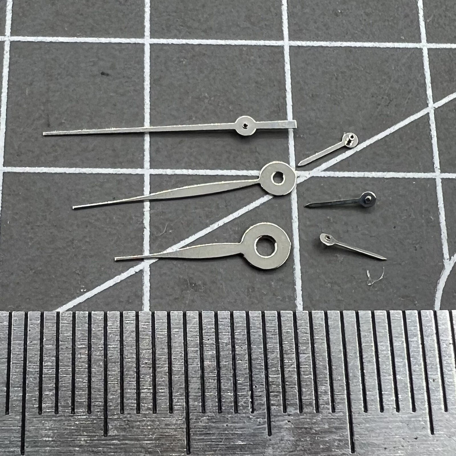 14mm silver long arrow watch hands for Miyota 0S11 movement, no lume, sleek design.