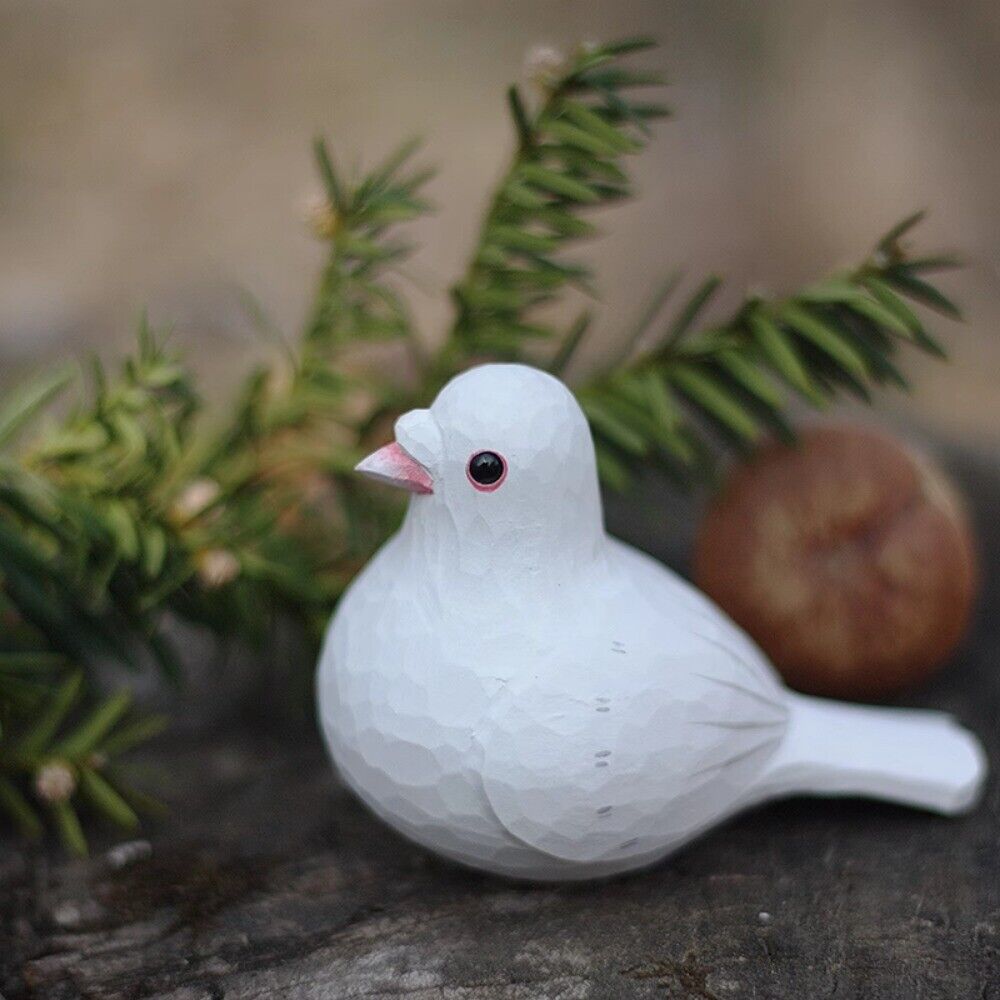 Handmade white carved peace dove wooden figurine, elegant decorative artwork for home or office.
