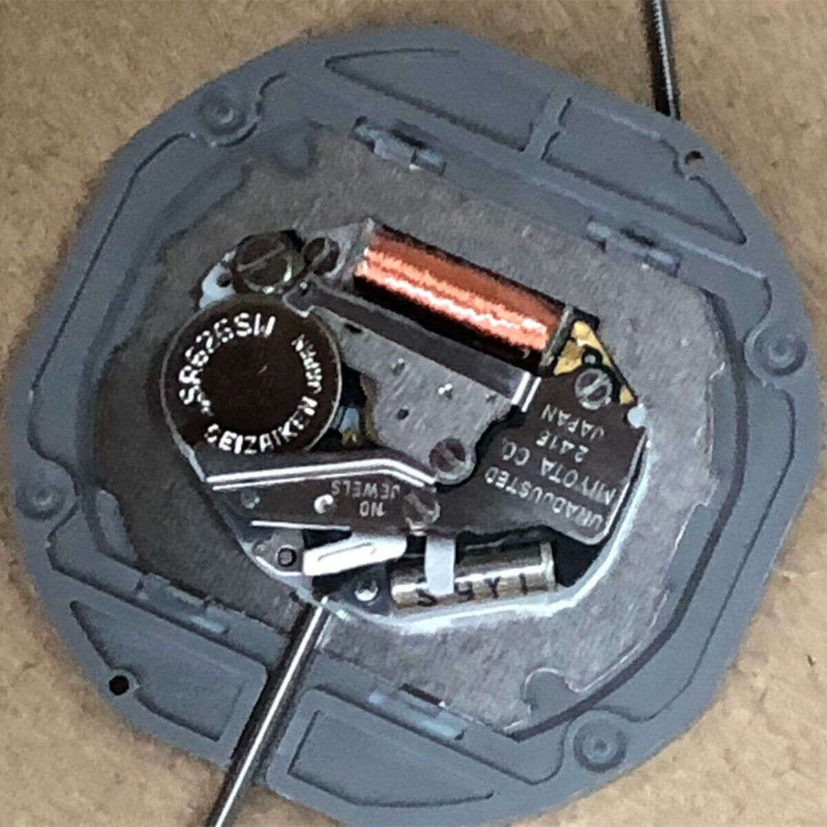 Miyota 2415 quartz watch movement with white date wheel at 3 o'clock for precise timekeeping