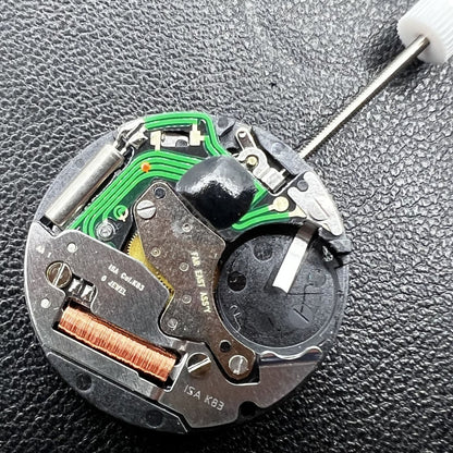 Swiss ISA Quarzuhrwerk K83 103 watch movement with date at 3 o'clock and three hands for precision timekeeping.