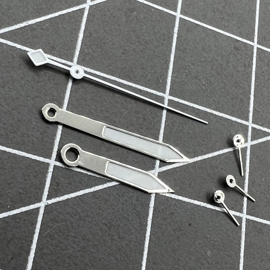 14.5mm silver and white trim green luminous watch hands for VD53 VD54 VD57 movement, glowing in low light.