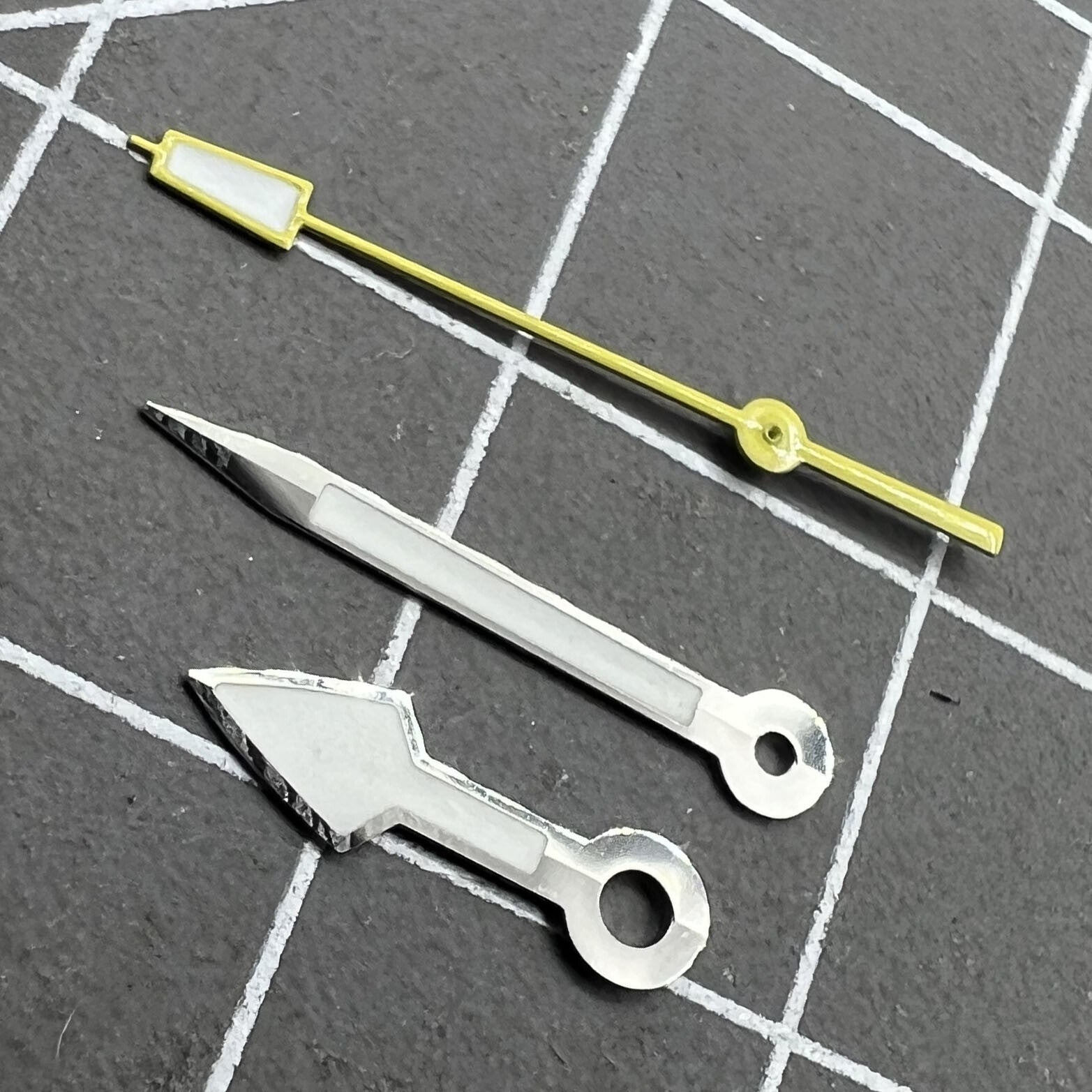 Arrow-shaped silver watch hands with yellow second hand and green lume, fitting NH35 NH36 movements.