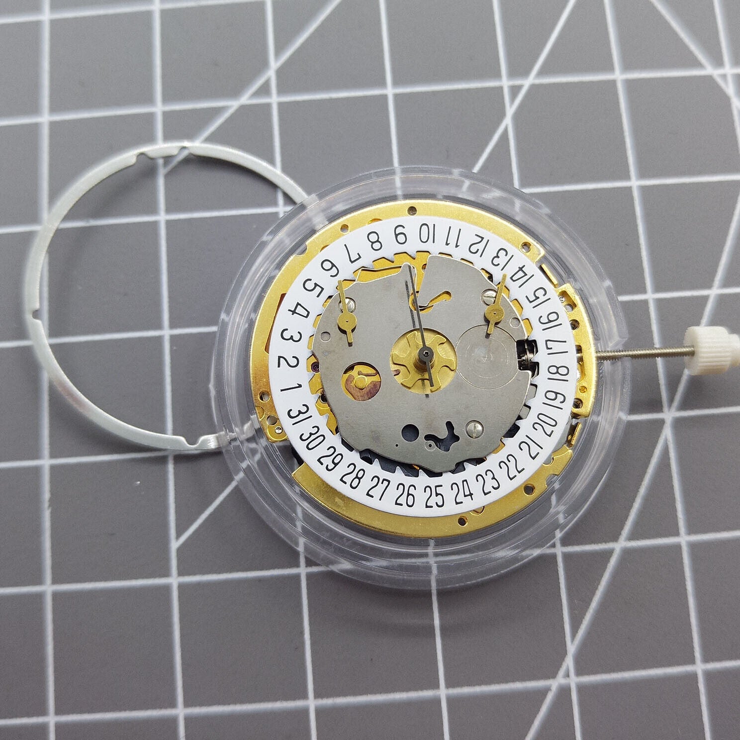 Swiss Made ISA 8171 quartz watch movement with date at 6, multifunctional for precision timekeeping.