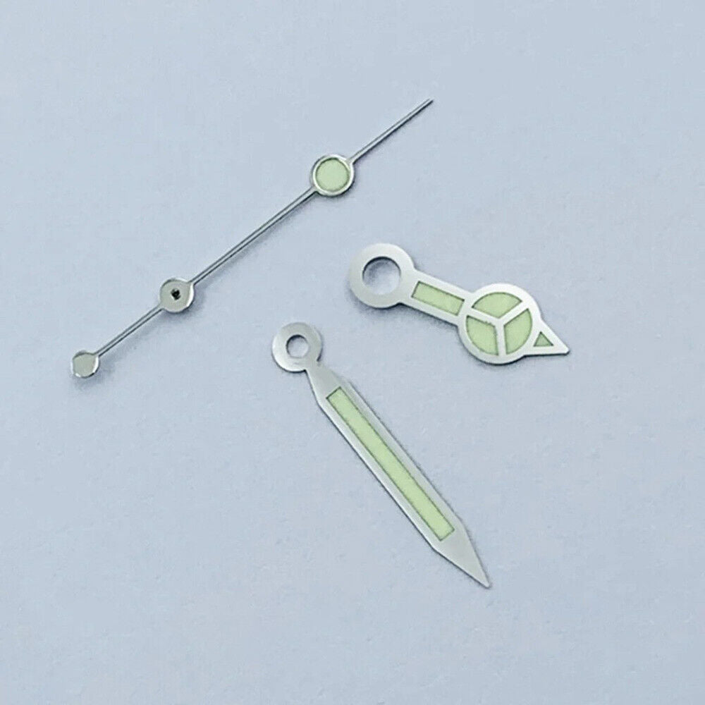 Green luminous watch hands with silver trim for NH35 NH36 movements, perfect for watch upgrades.
