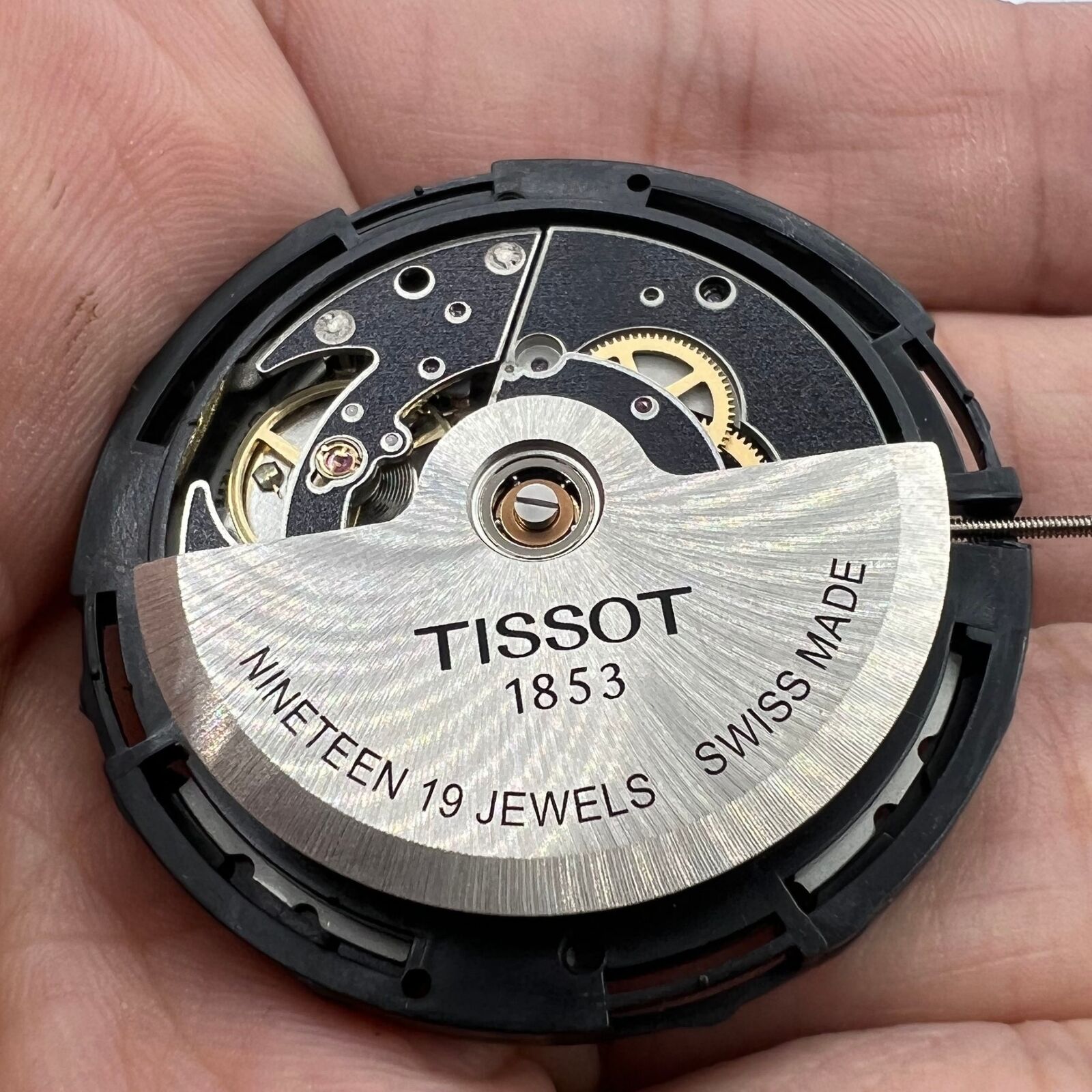Tissot ETA C15.111 chronograph movement with white dial, Swiss precision watch accessory.