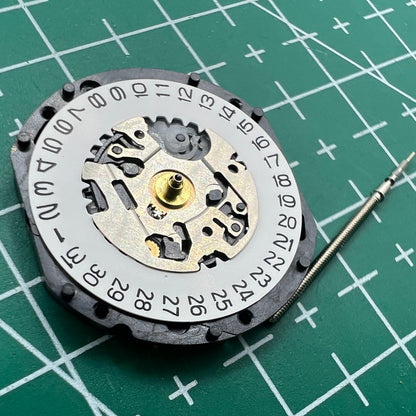 Hattori Epson TMI VX12E quartz watch movement with date display at 3 o'clock for precise timekeeping.