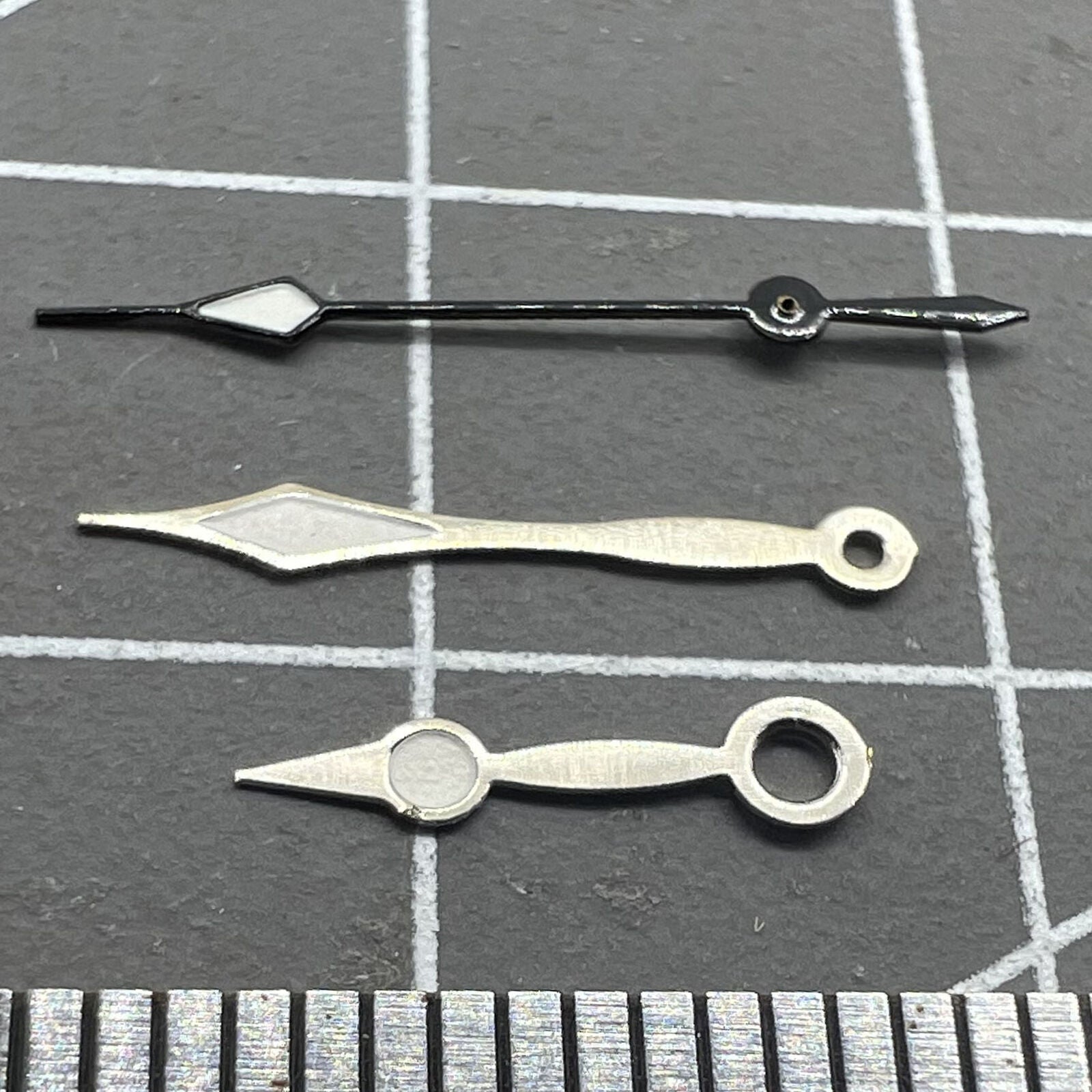 LUME black second hand for Miyota 2035 quartz watch movement, precise replacement part.