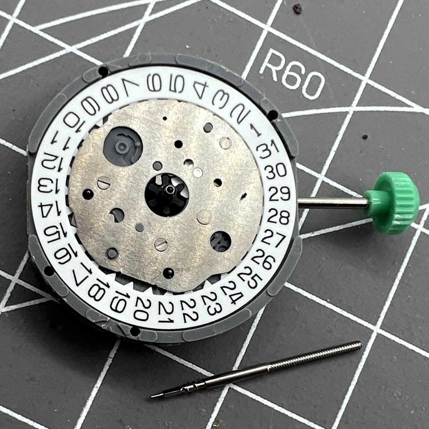 Miyota FS20 chronograph watch movement with date at 3, Japan-made quartz precision.