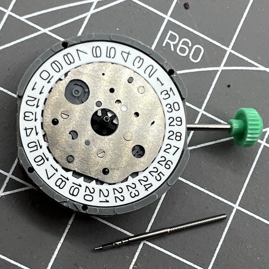 Miyota FS20 chronograph watch movement with date at 3, Japan-made quartz precision.