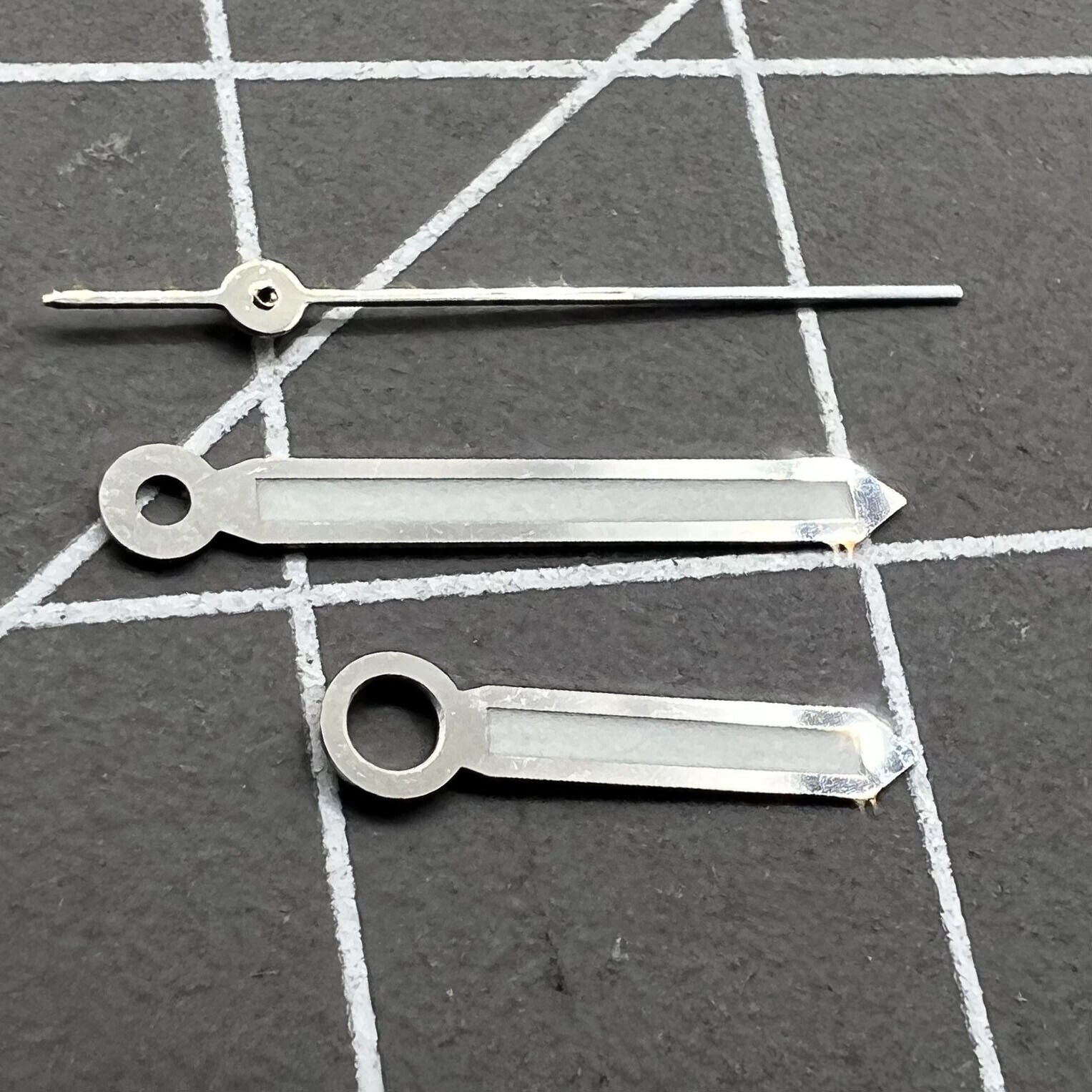 17mm silver trim green luminous watch hands set for Miyota 2035 movement with enhanced visibility.