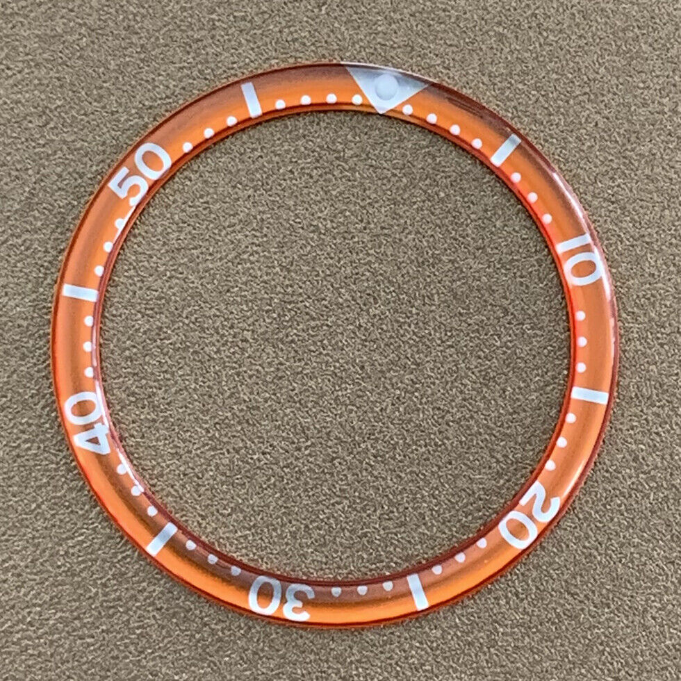 White font 39mm aluminum bezel insert with circular arc bevel for watch customization.