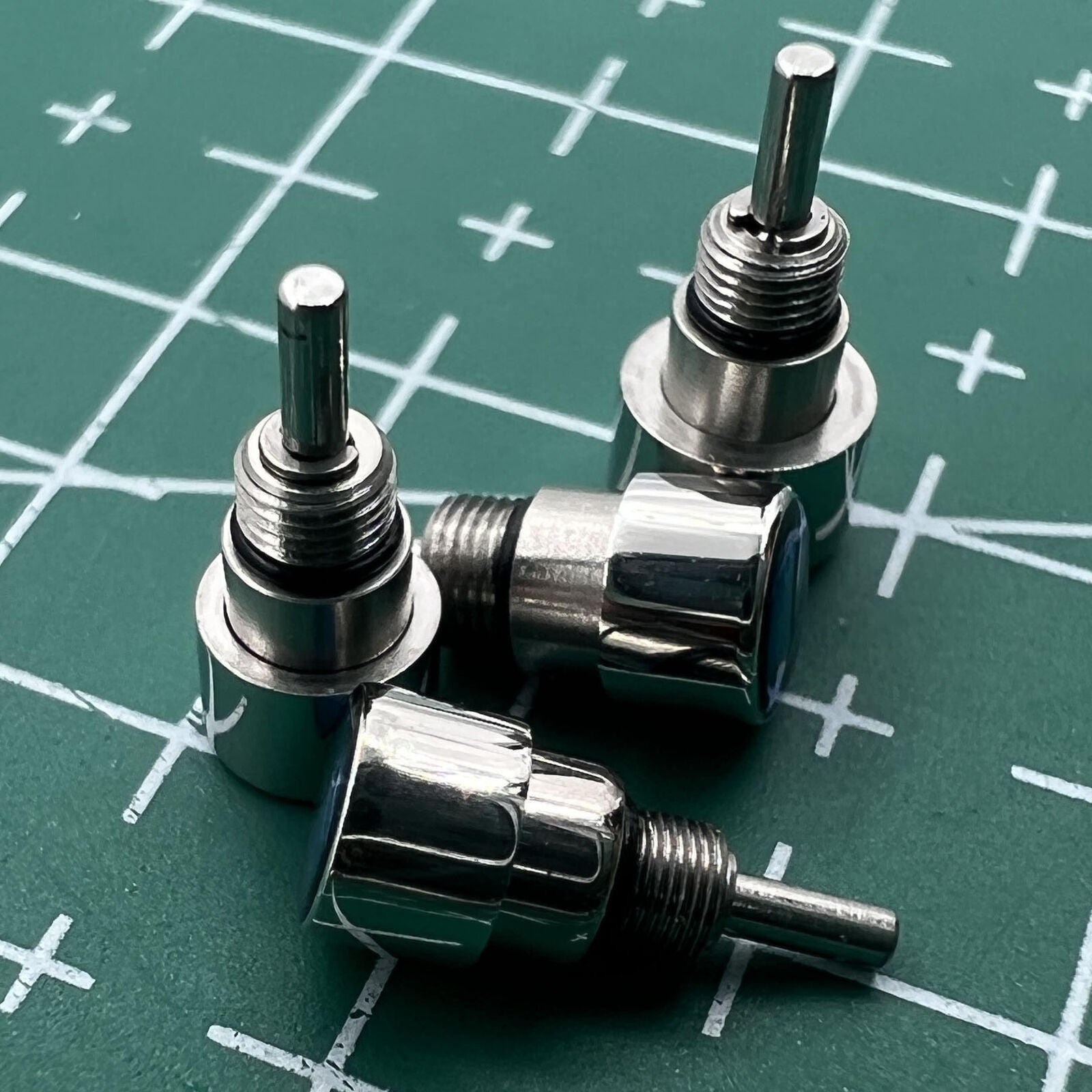 Silver stainless steel watch with classical pusher drive, perfect for elegant timekeeping.