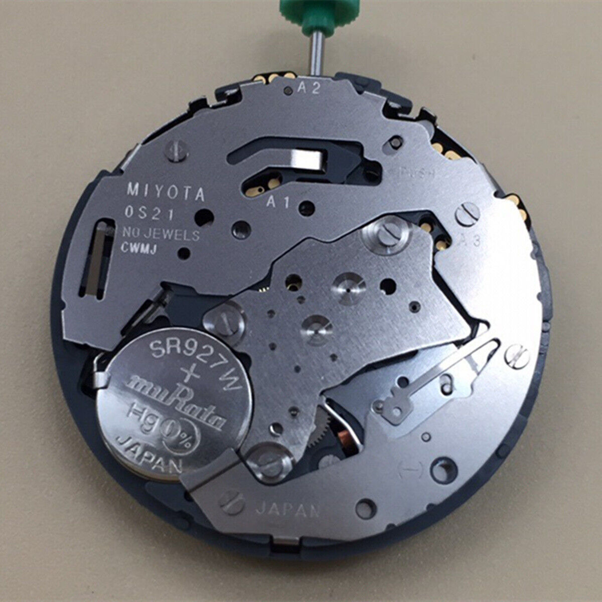 Miyota OS21 quartz watch movement with small seconds at 3 and 9, single calendar at 6, precise timekeeping accessory.