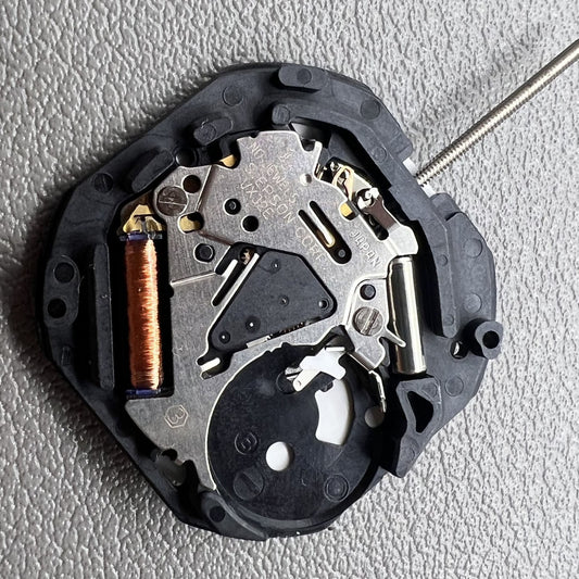 1. Japan Hattori Epson VX32 quartz watch movement with date at 3 o'clock, precise timekeeping.  