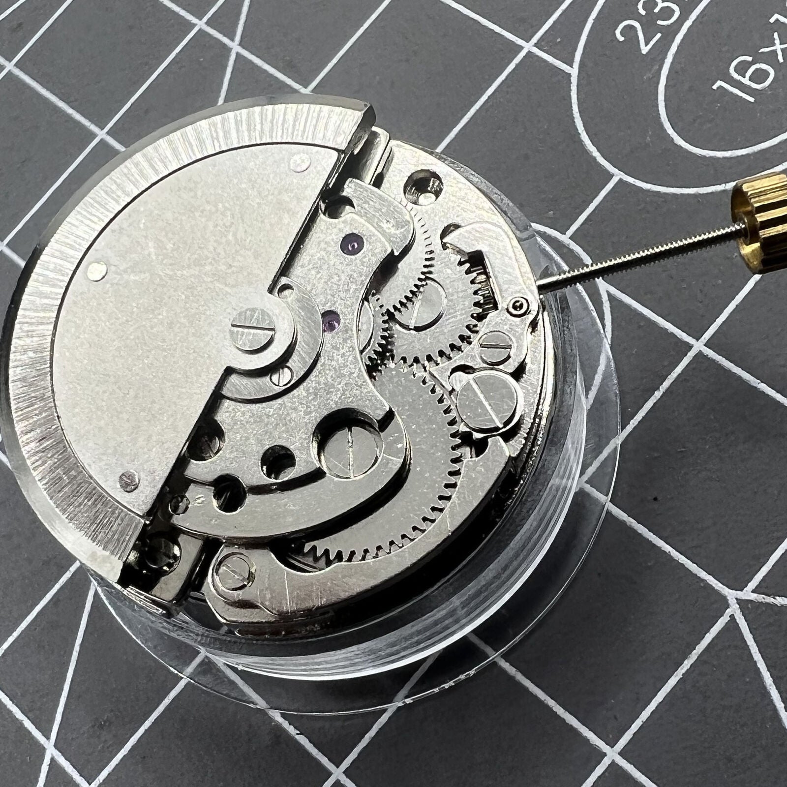 7120 Automatic Mechanical Watch with moon phase at 6 o'clock and visible bare balance wheel.