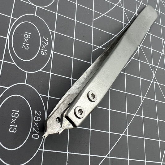 Spring bar tweezer tool by Bergeon 7825 for precise watch lug spring bar removal and fitting.