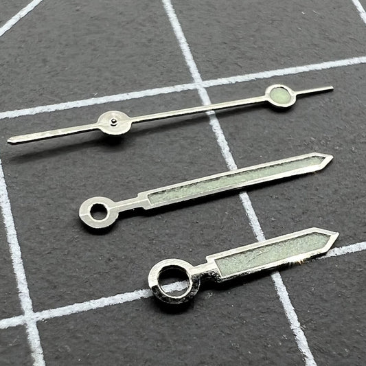 Silver-trimmed green luminous watch hands for Miyota 1M12, enhancing style and nighttime visibility.