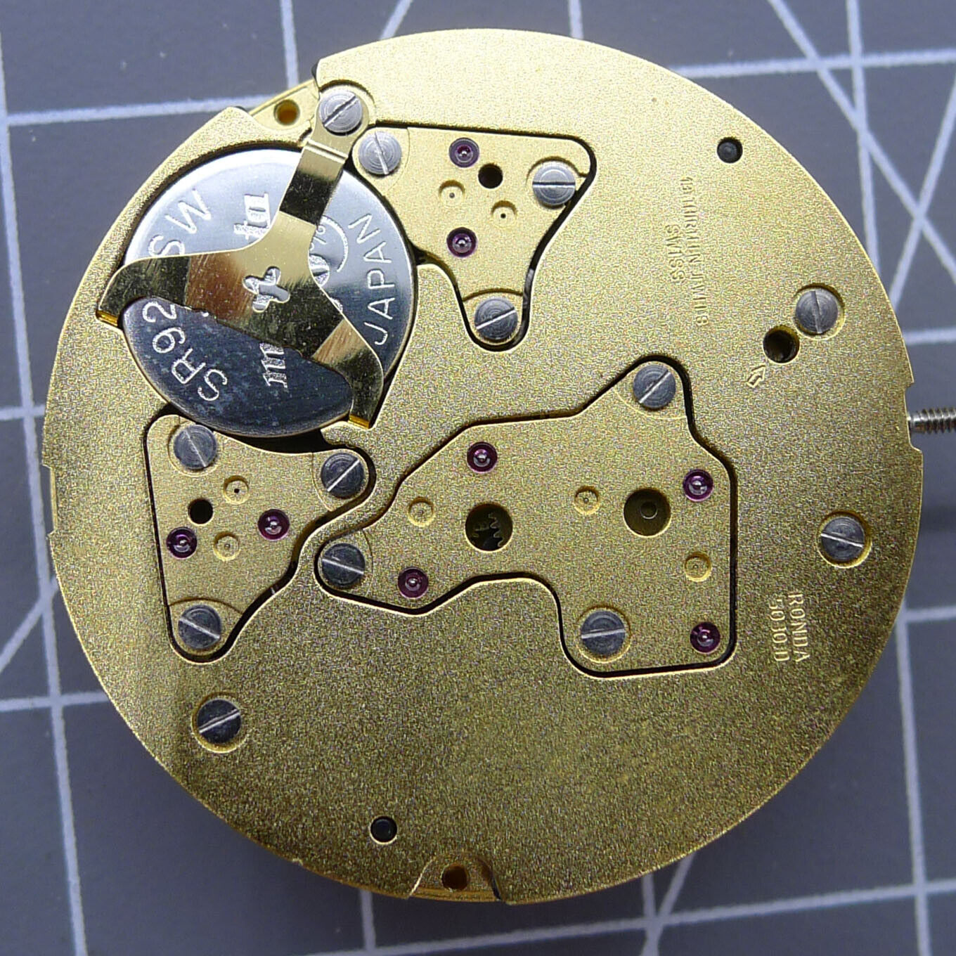 Swiss Made Ronda 5030D quartz watch movement with date display at 4 o'clock, precise timekeeping.