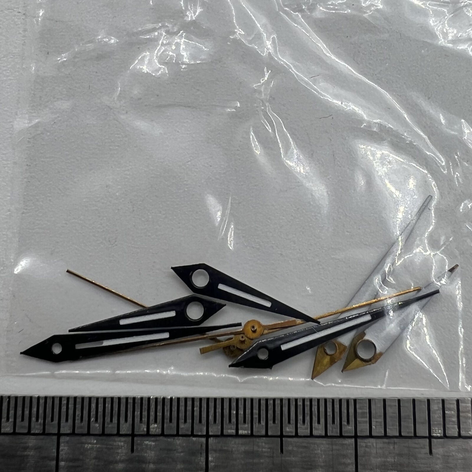 Black trim luminous watch hands, designed for Miyota 2035 quartz movements, ensuring accurate timekeeping.