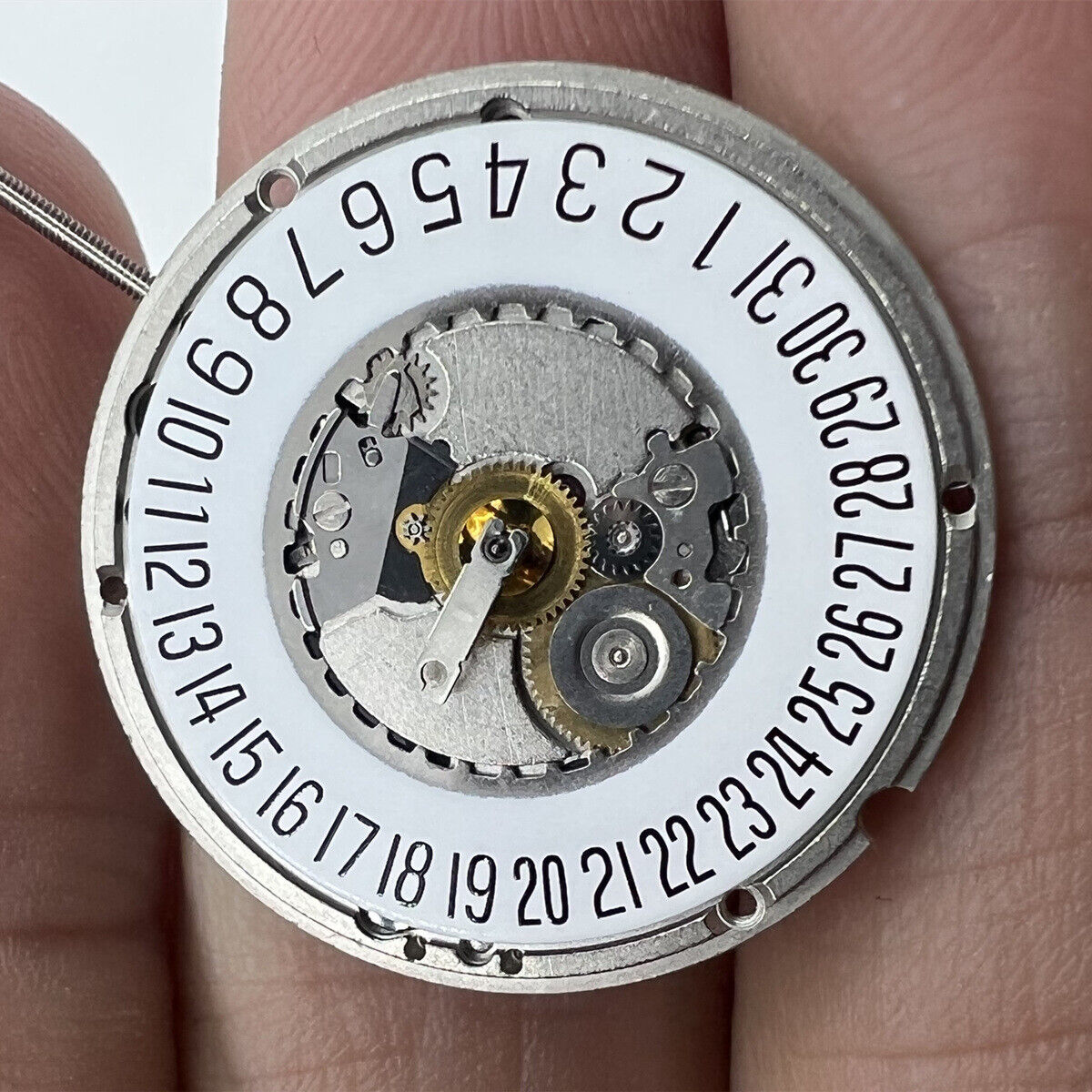 ETA 955.414 Swiss quartz watch movement with date display at 6 o'clock, precision timekeeping accessory.