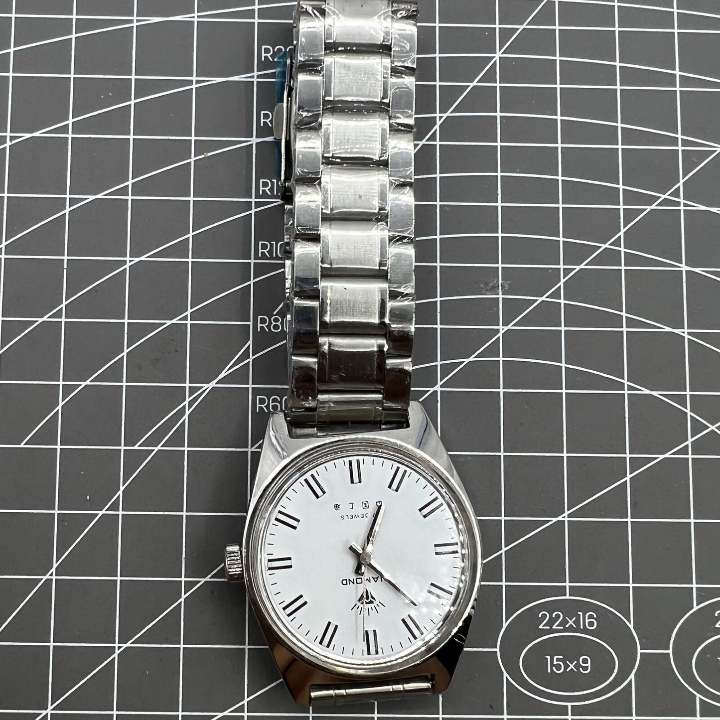 Shanghai Diamond 38mm manual mechanical watch with 17 jewels, white dial, silver case, elegant design.