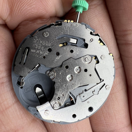 Miyota OS20 quartz watch movement with date display, precision made in Japan for watchmakers.