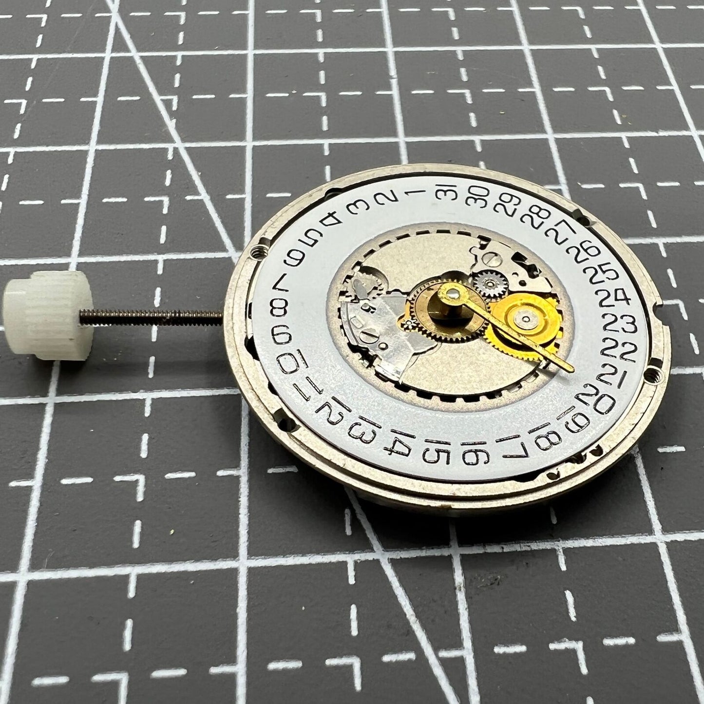 ETA 955.414 Swiss Made quartz watch with silver dial, single calendar at 3 o'clock, and polished stainless steel case.