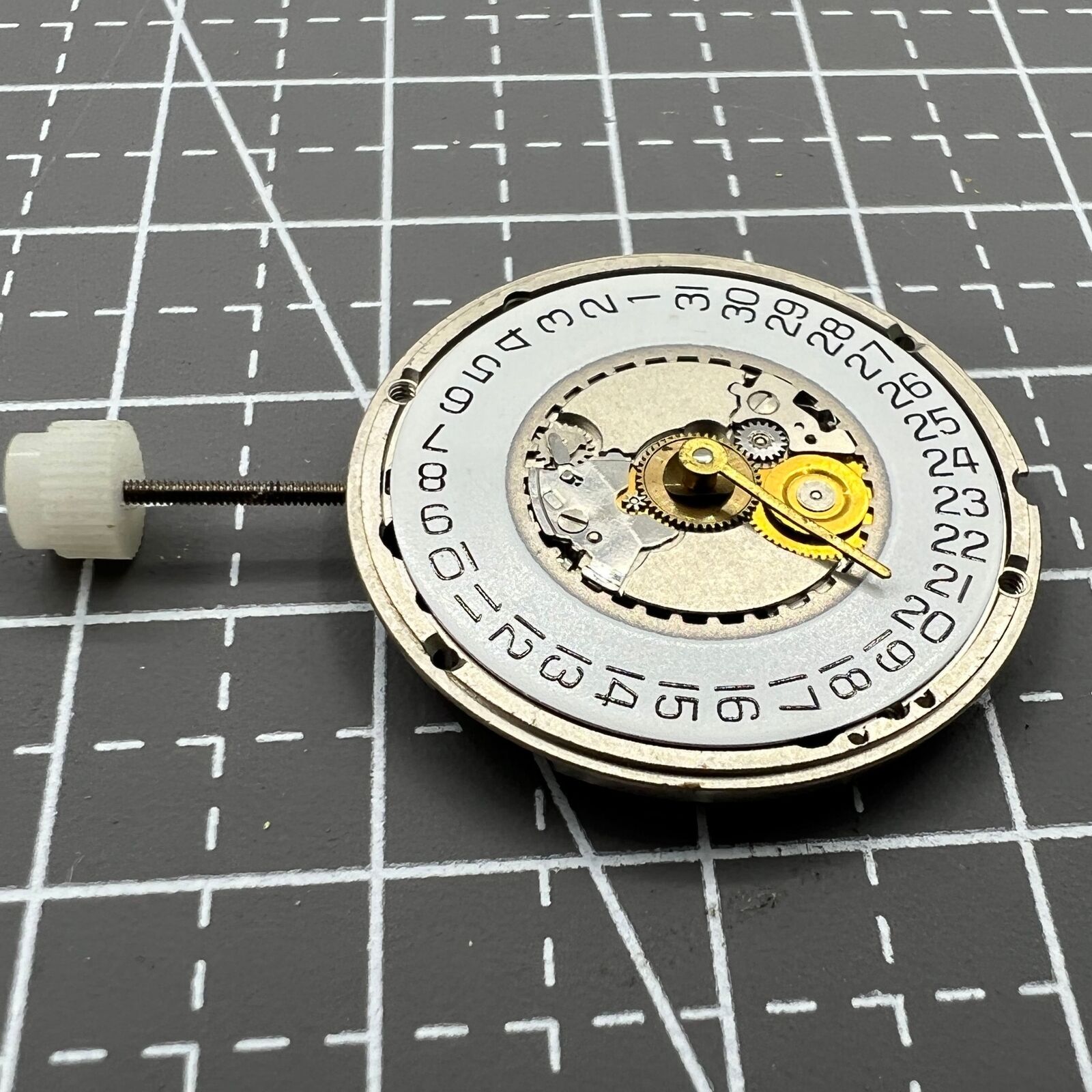 ETA 955.414 Swiss Made quartz watch with silver dial, single calendar at 3 o'clock, and polished stainless steel case.