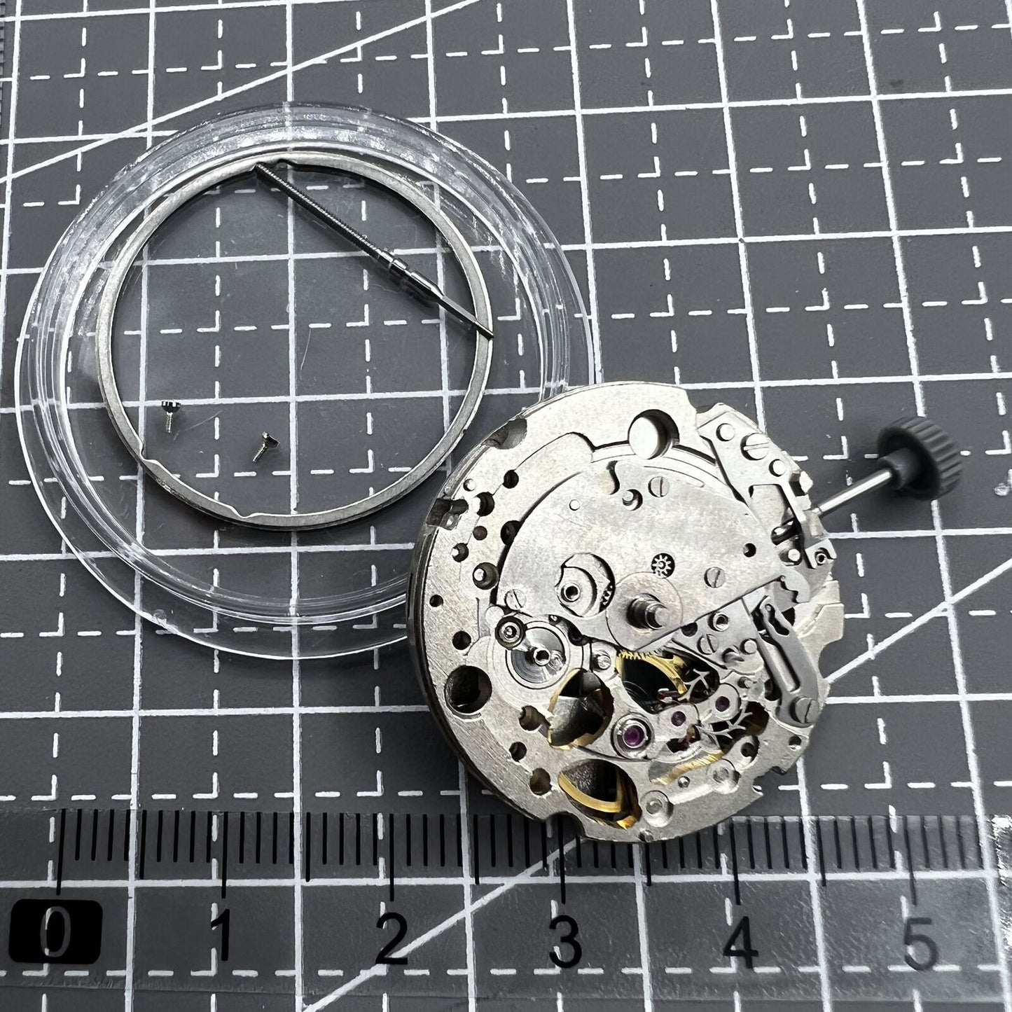 Miyota Citizen 82S5 silver plated automatic watch movement showcasing precise mechanical craftsmanship.