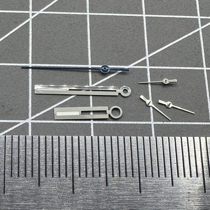 Luminous silver watch hands for Ronda 5021D quartz movement, ideal for precise timekeeping in watch repairs.