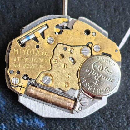 Miyota 4T13 quartz movement watch with single calendar date at 6 o'clock, precision Japan-made mechanism.