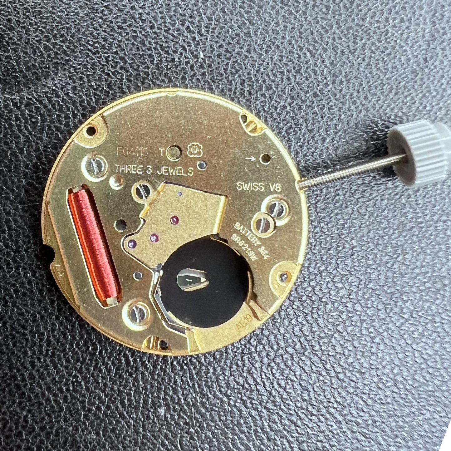 Swiss ETA F04.115 quartz watch movement with 3 hands and date display at 3 o'clock for precision timing.