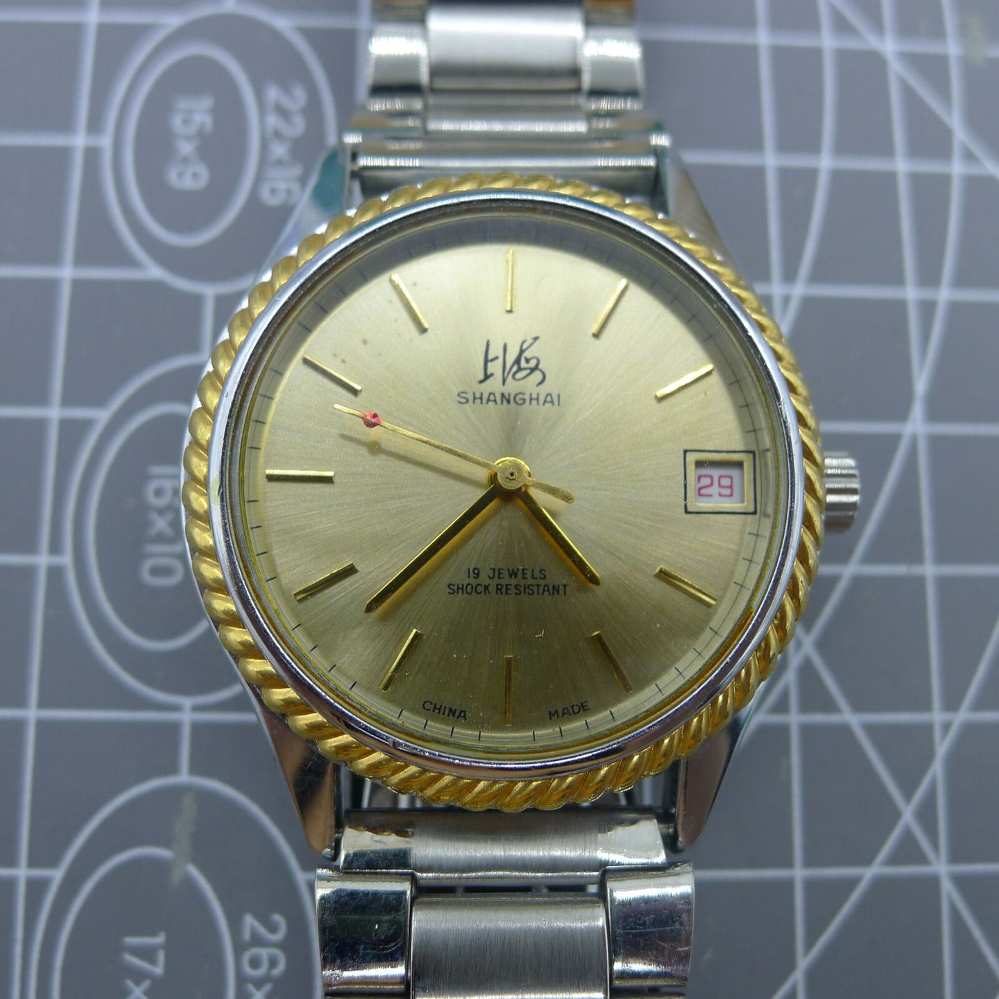 Shanghai Factory 36.5mm manual mechanical watch with 19 jewels, shock-resistant for daily wear durability.