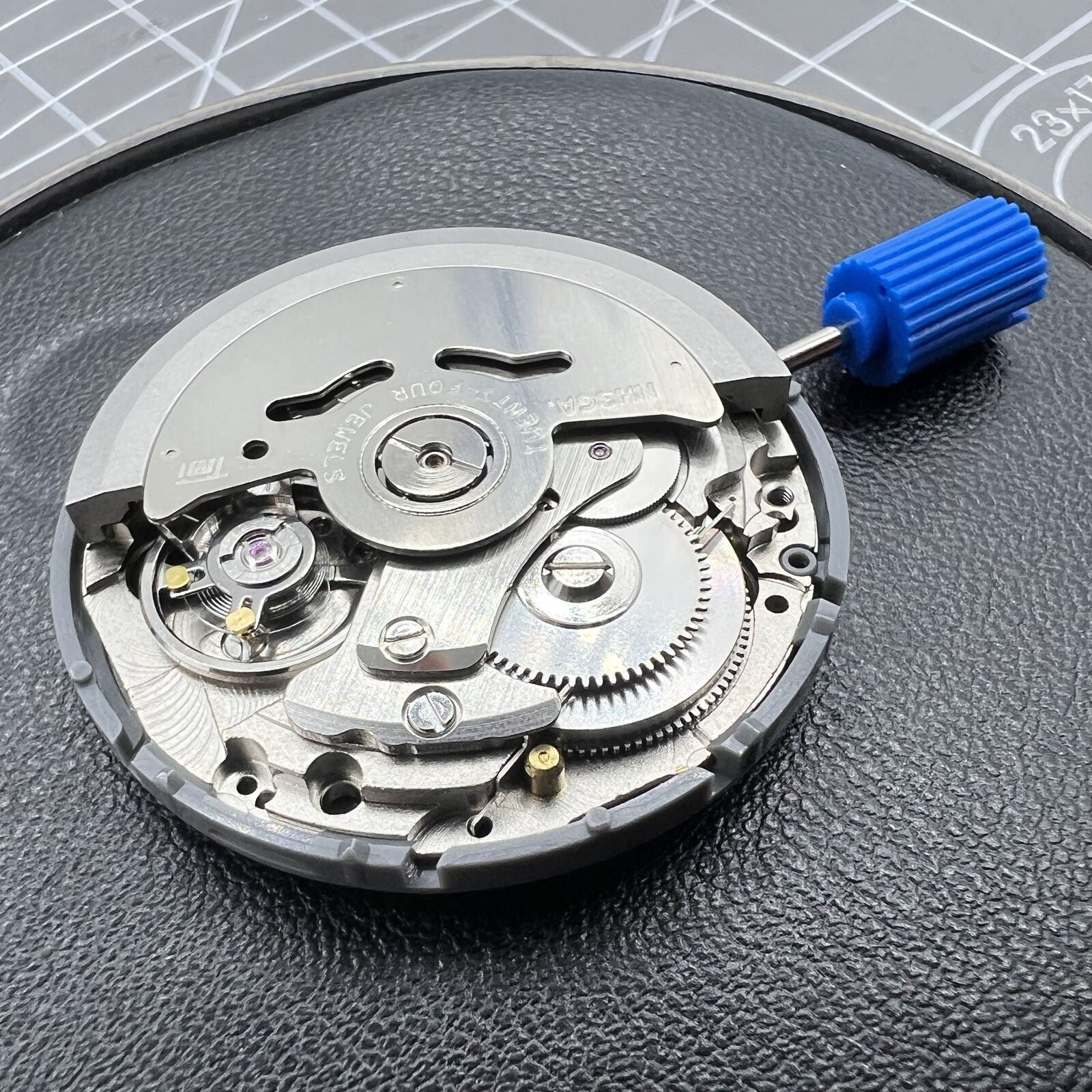 Black NH36A automatic watch movement showcasing the Roman wheel crown at 3 o'clock, precision gear by NH36.