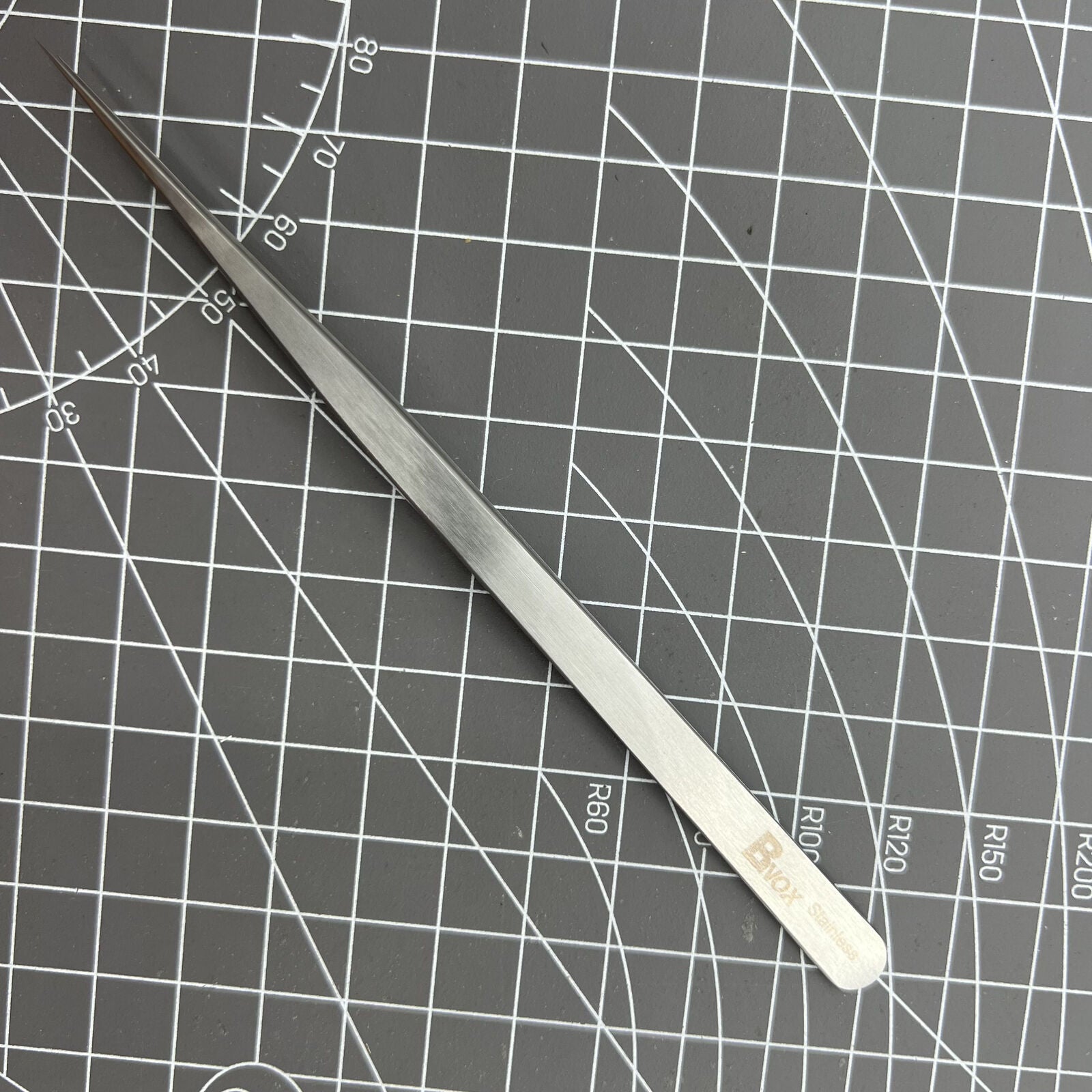 Swiss Made Bergeon 7027-SS tweezer with narrow, fine stainless steel tips for precise watch repair tasks.