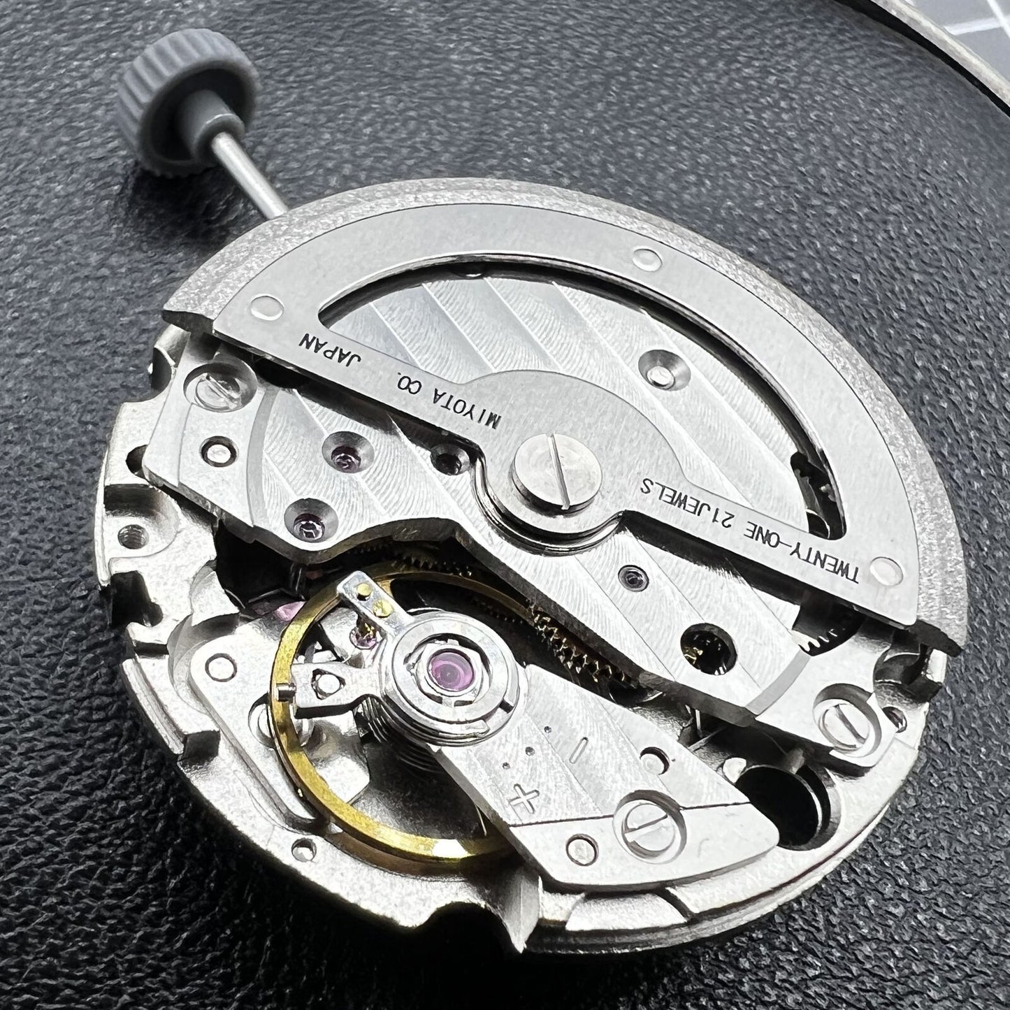 Miyota 8245 silver automatic movement by Citizen, precision-engineered Japanese watch accessory mechanism.