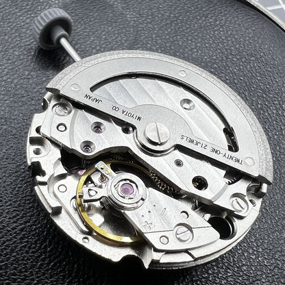 Miyota 8245 silver automatic movement by Citizen, precision-engineered Japanese watch accessory mechanism.
