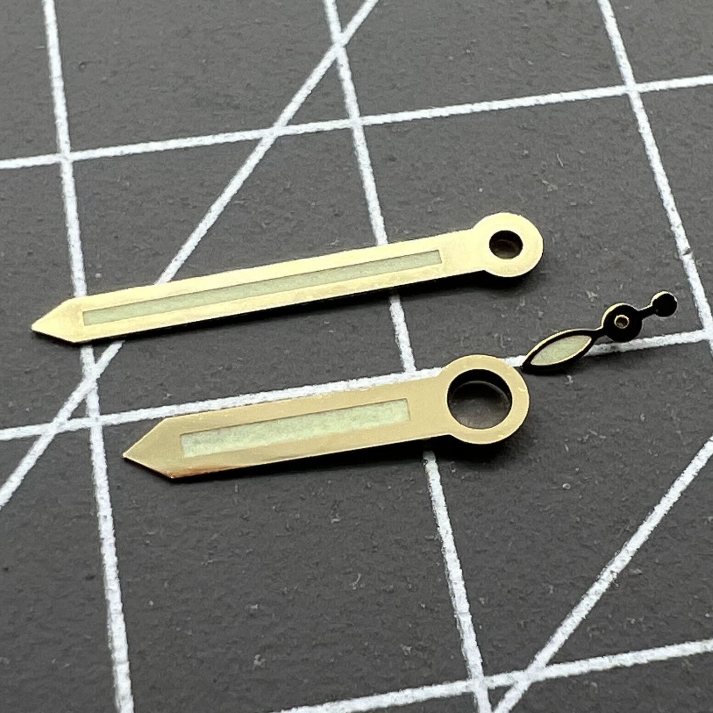 Golden trim green luminous watch hands for ST3600 movement, enhancing visibility and style.