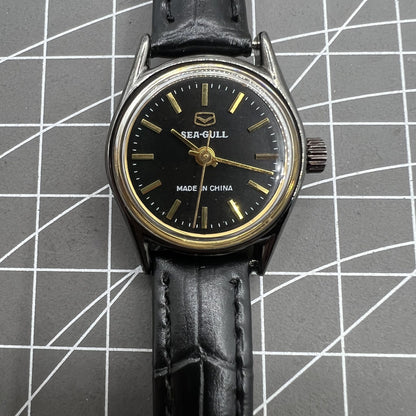 27mm Tianjin Seagull ladies watch with manual movement and gold nail hour markers, elegant design.